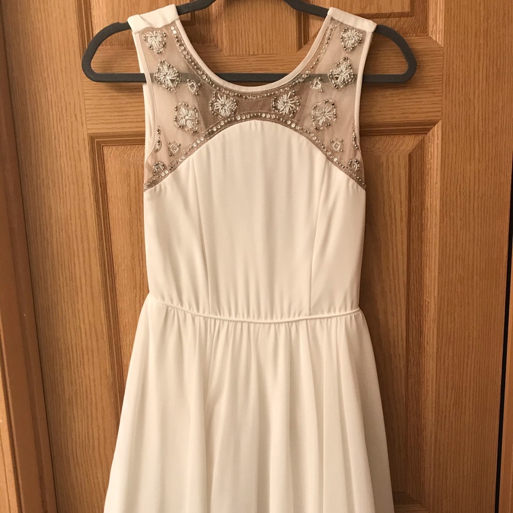 White dress with silver beading on chest
